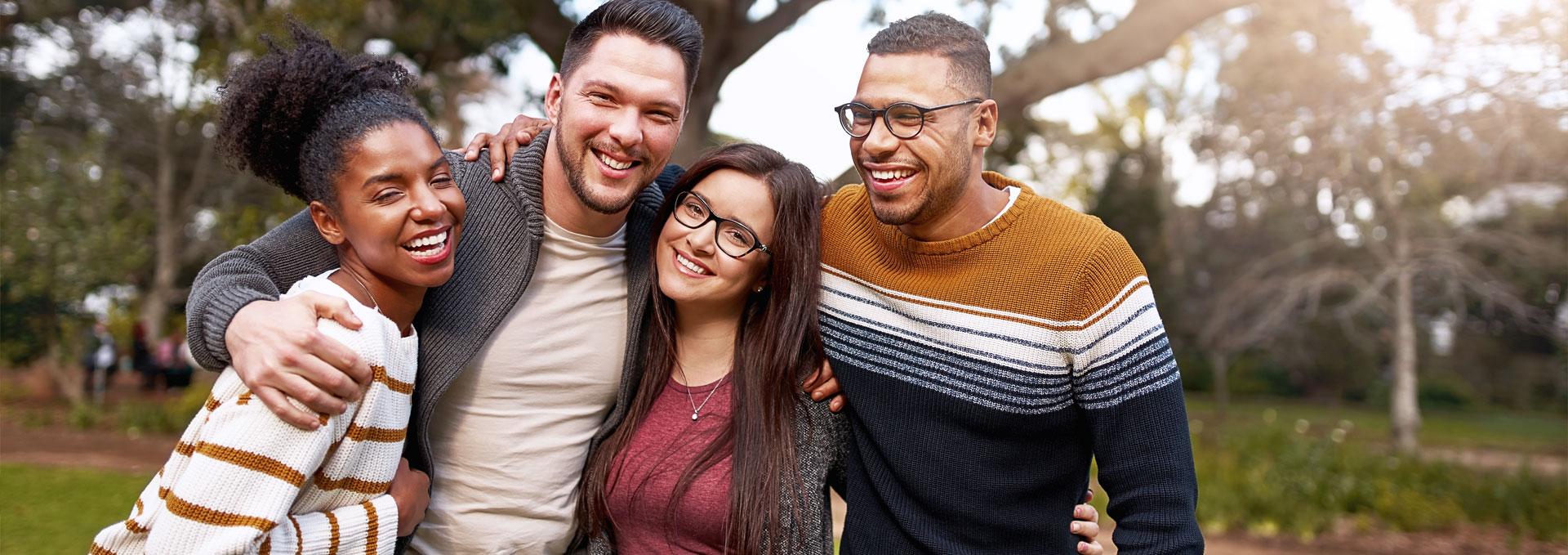 A group of friends smiling at their San Francisco dentist