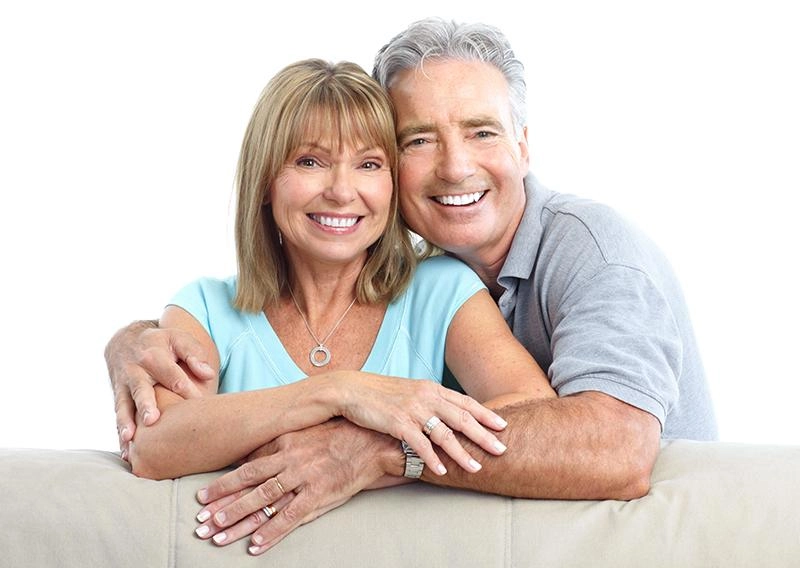 Senior Happy Couple With Dental Implants From Marina Tooth Fairy Dental